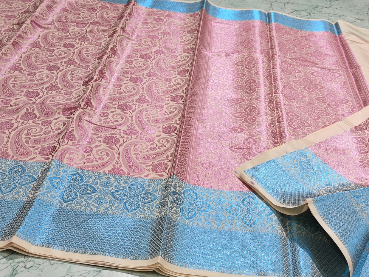 Handwoven Banarasi Taffeta Soft Silk Saree*
Beautiful Tanchui design All over body*
Zari weave pallu and blouse*