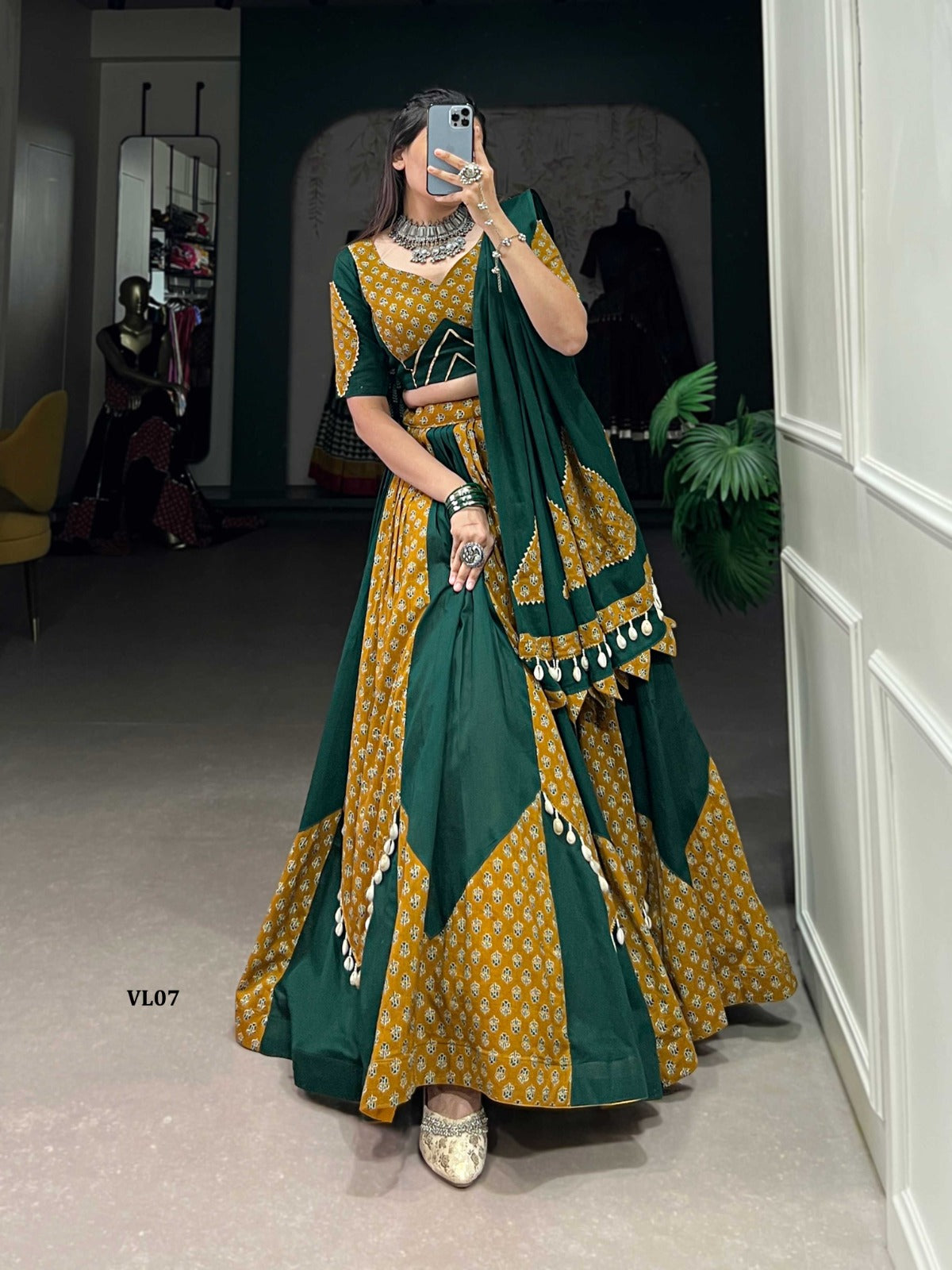 Navratri Chaniya Choli
Lehenga:* Pure Cotton Plain And Printed With Cowrie (Kodi) Lace Touch Up
*Choli:* Pure Cotton Plain And Printed With Gota Patti And Cowrie (Kodi) Lace Touch up