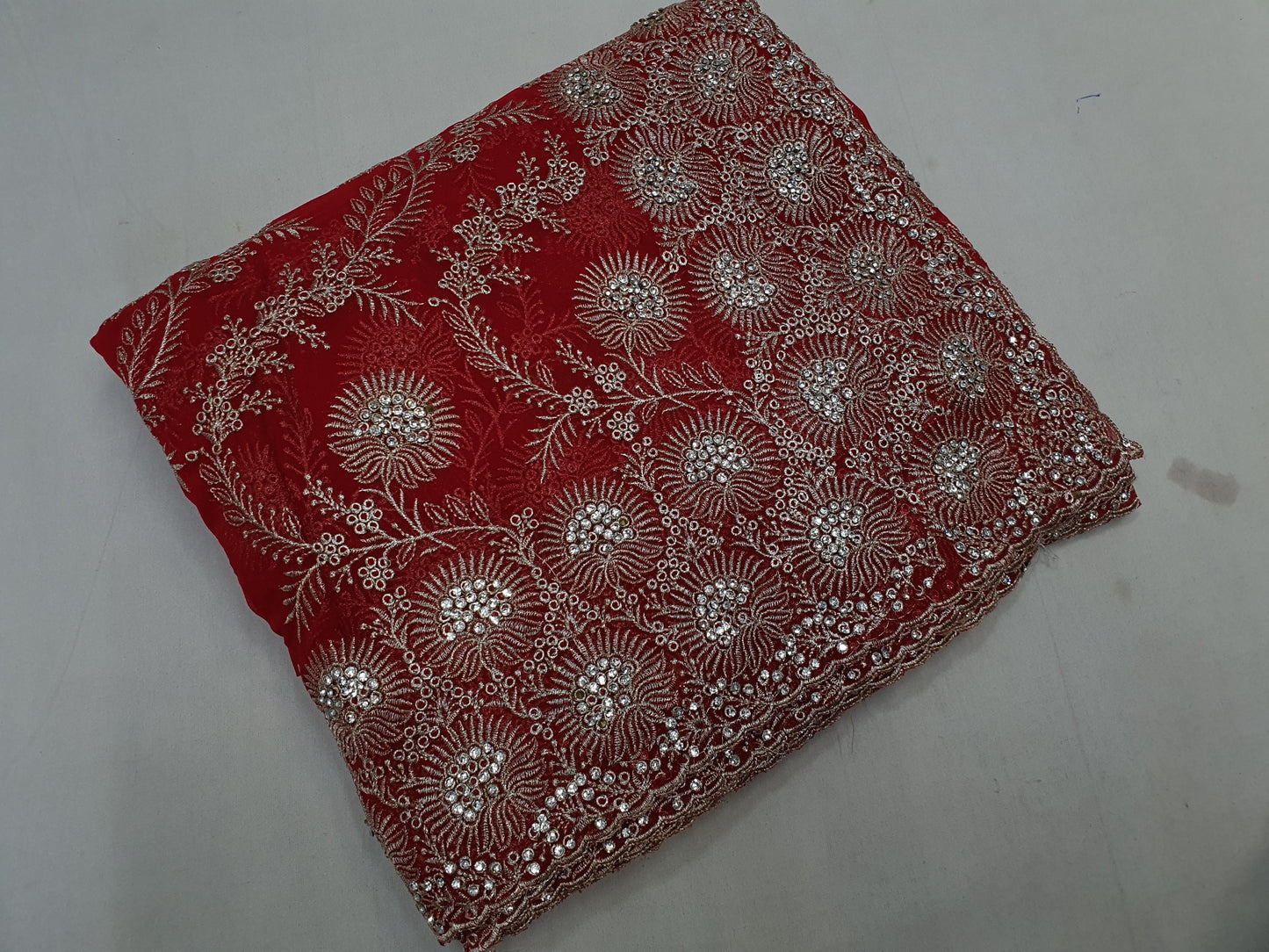 Allover silver jari jall with jarkan stone border on Georgtee 
Saree