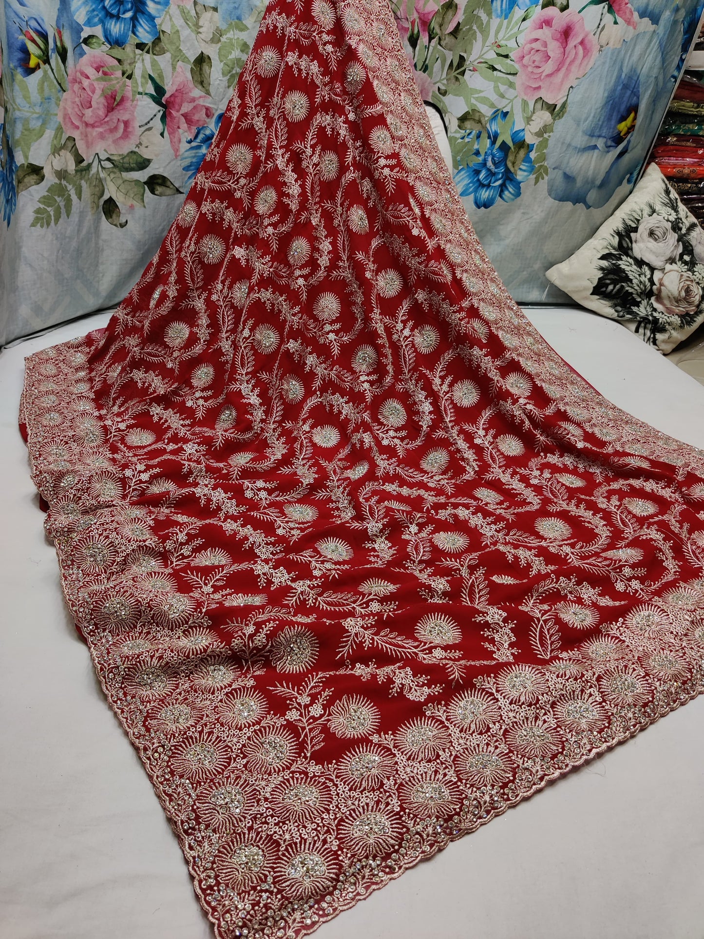 Allover silver jari jall with jarkan stone border on Georgtee 
Saree