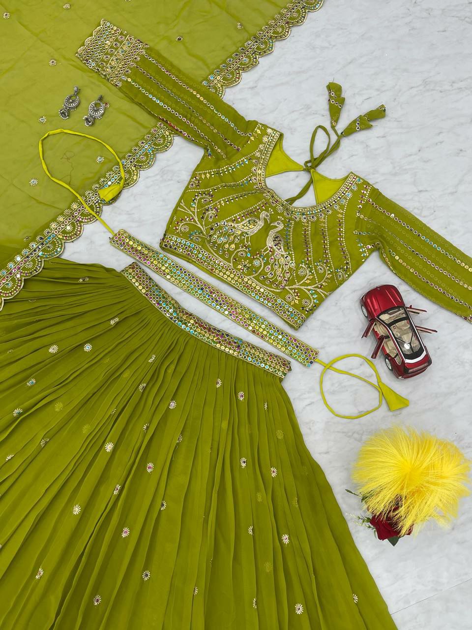 Perfect for mehndi ceremony lehenga choli set. 
Fabric:- Fox Georgette 
Work:- Heavy 7mm multi Sequence Work 
INNER:  Micro Cotton