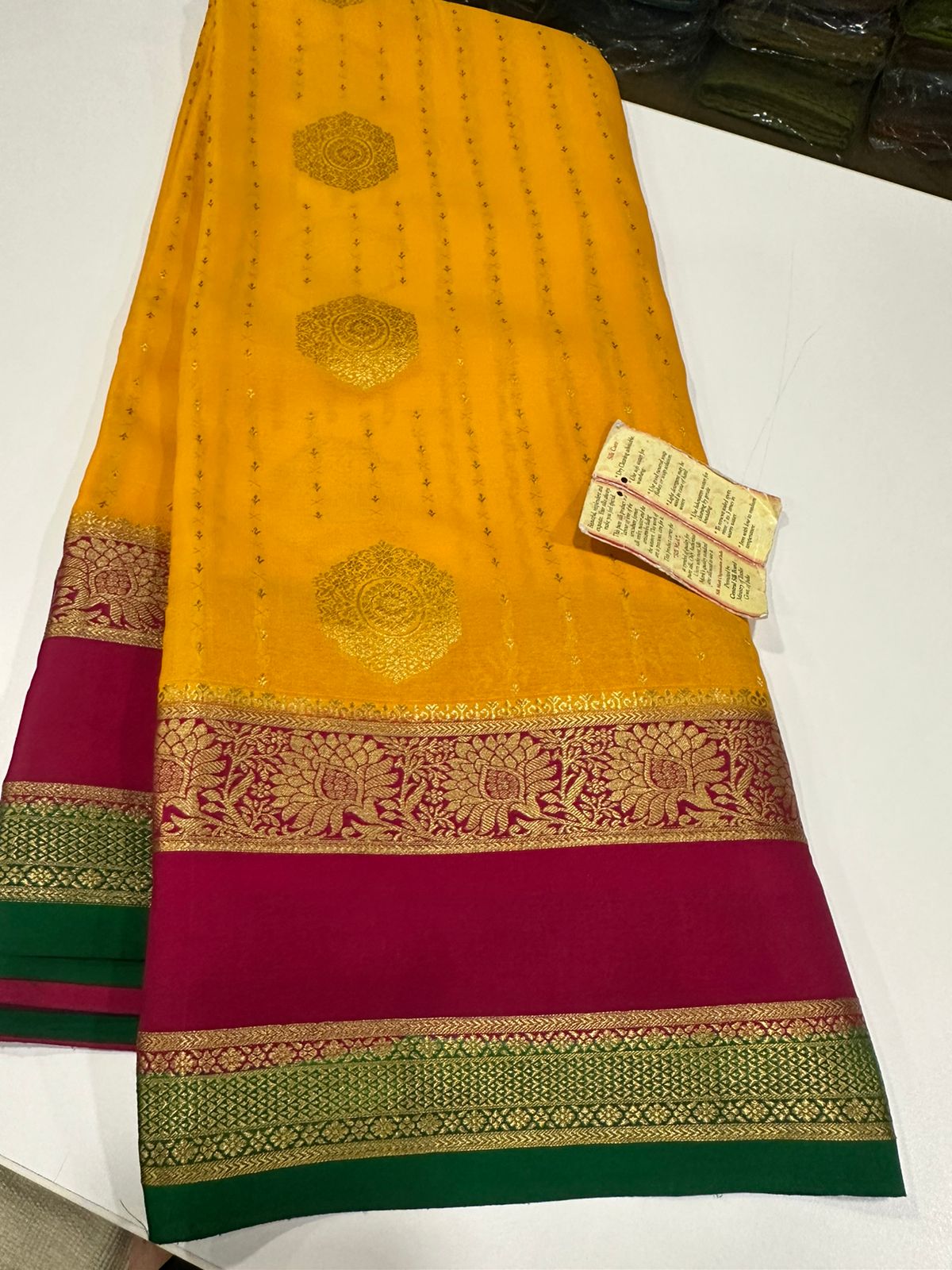 Pure Mysore silk sarees
120 grm thickness  with rich pallu 
Silk mark certified
Big Bentex border with motifs on the body n vertical lines   .....small motifs all over body with rich pallu