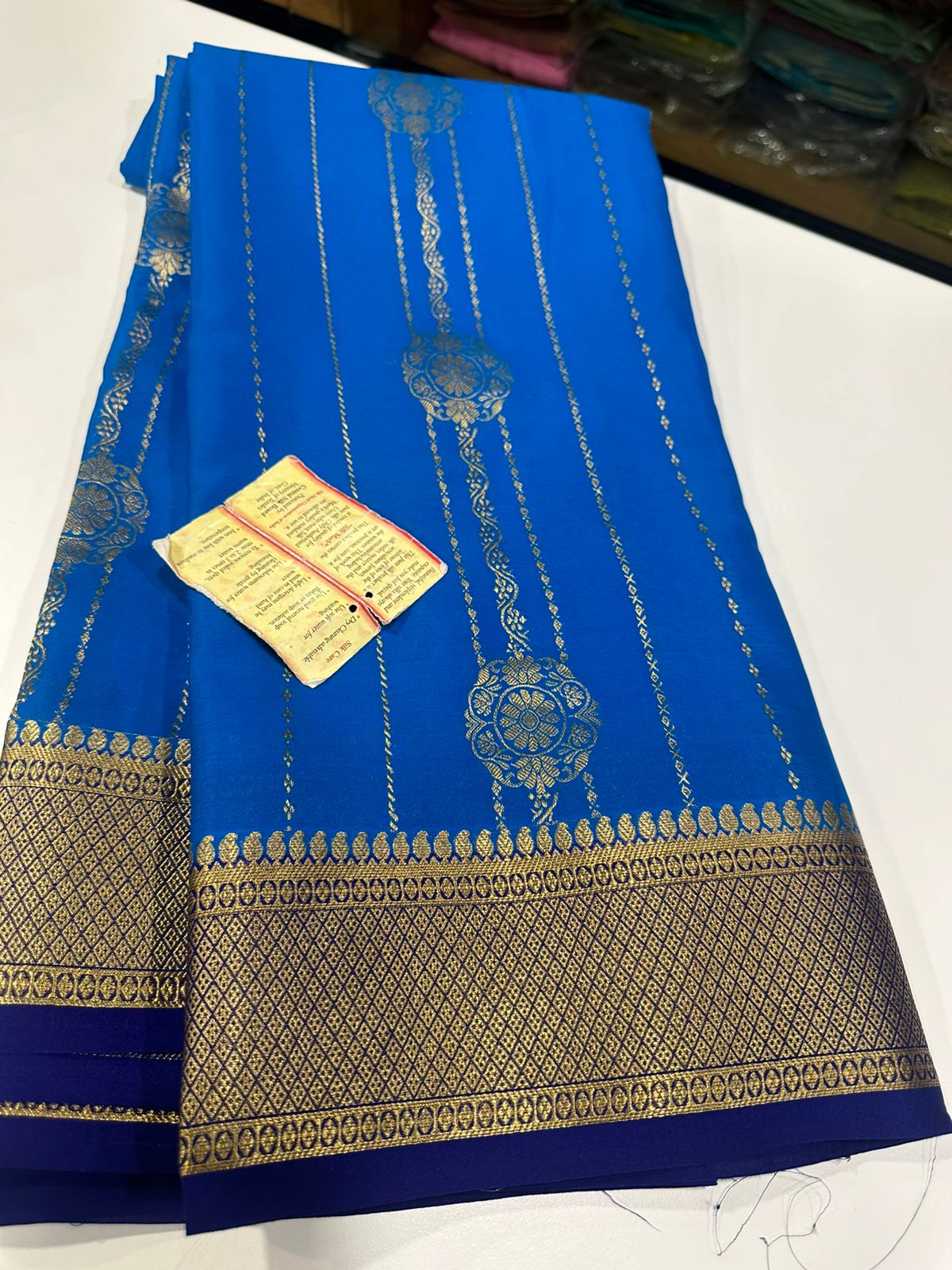Pure Mysore silk sarees
120 grm thickness  with rich pallu 
Silk mark certified
Big Bentex border with motifs on the body n vertical lines   .....small motifs all over body with rich pallu