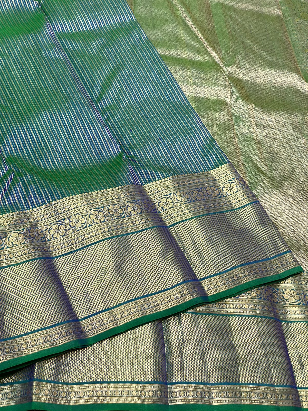 Pure Kanchivaram handloom silk saree with pure 2g zari traditional long border strip butta all over saree 
Silkmark certified