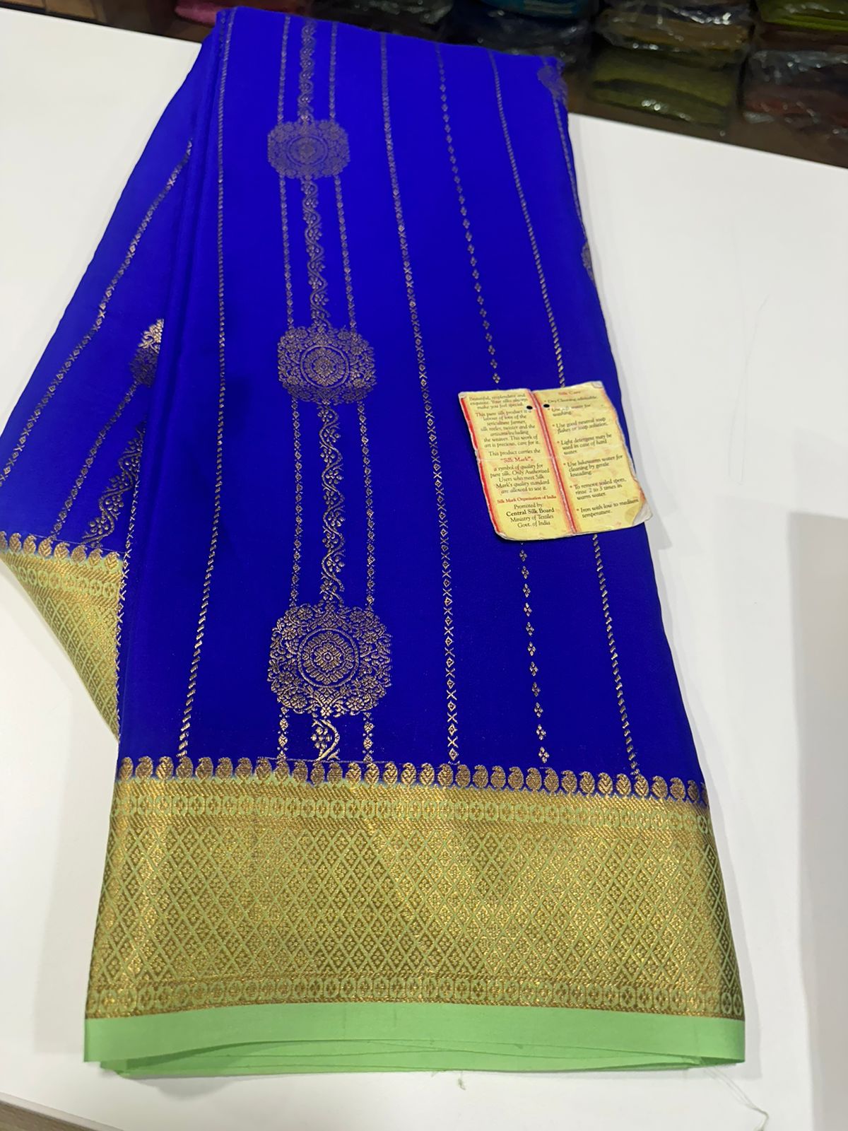 Pure Mysore silk sarees
120 grm thickness  with rich pallu 
Silk mark certified
Big Bentex border with motifs on the body n vertical lines   .....small motifs all over body with rich pallu