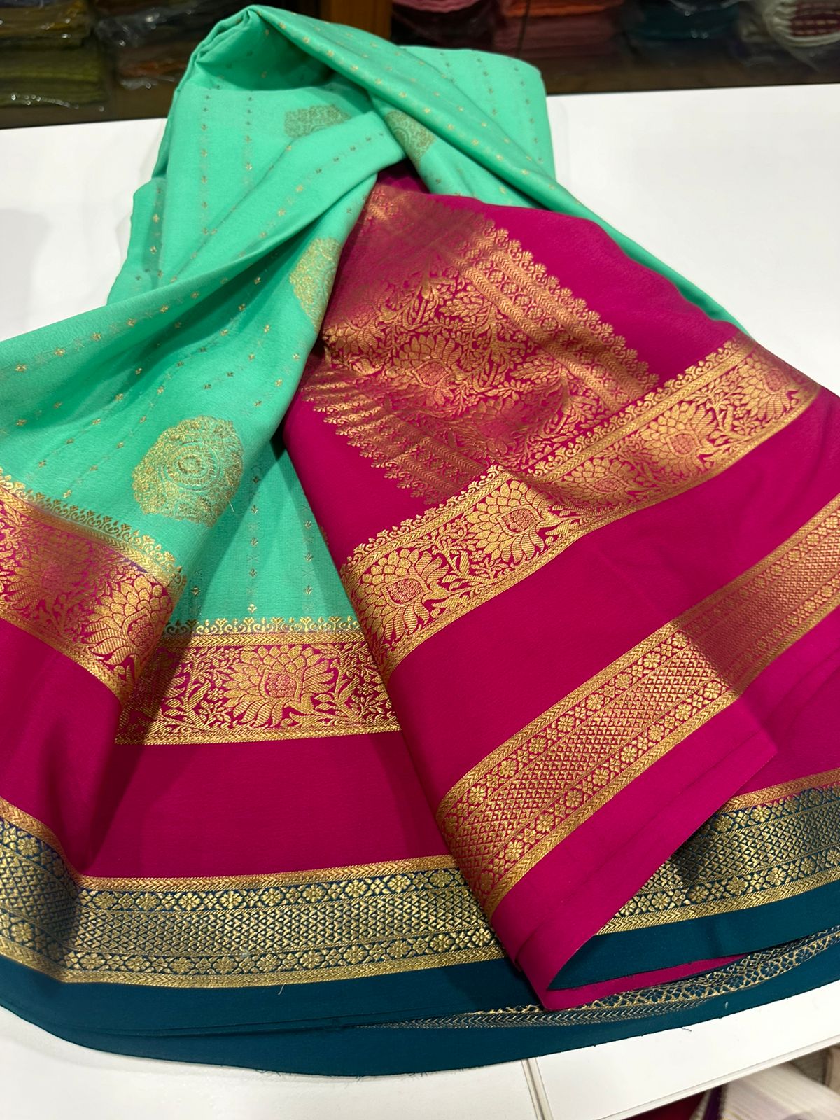 Pure Mysore silk sarees
120 grm thickness  with rich pallu 
Silk mark certified
Big Bentex border with motifs on the body n vertical lines   .....small motifs all over body with rich pallu