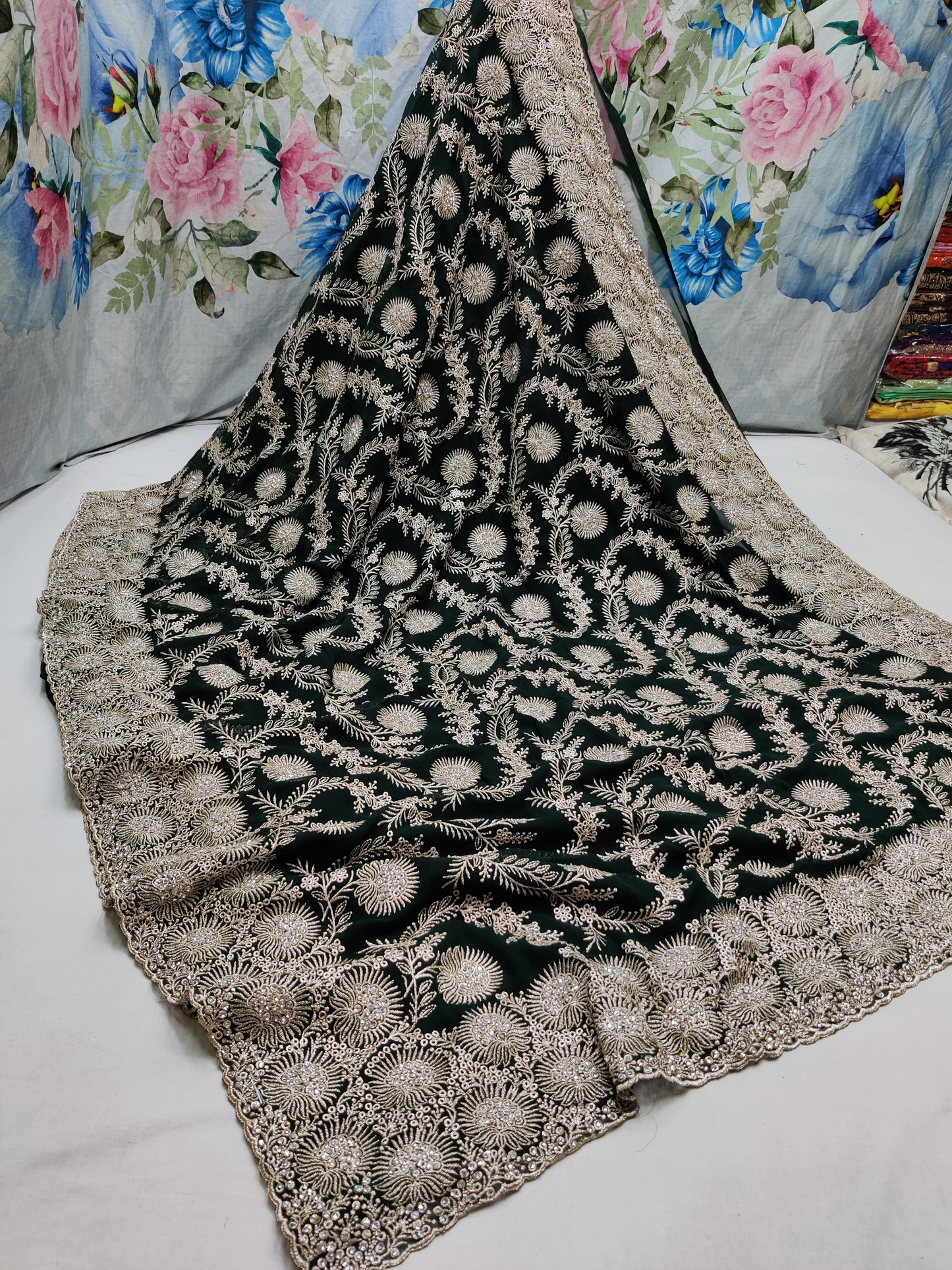 Allover silver jari jall with jarkan stone border on Georgtee 
Saree