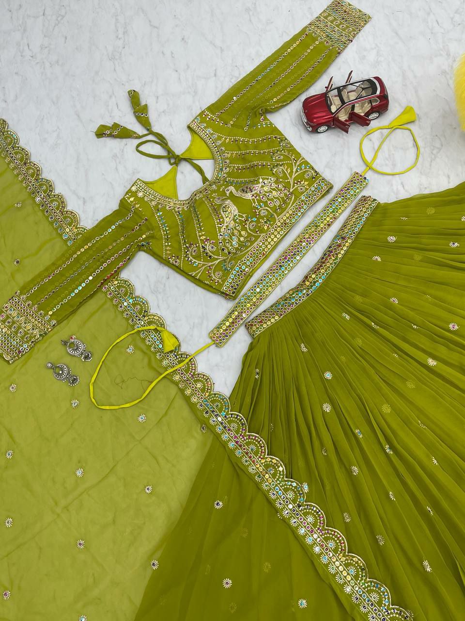 Perfect for mehndi ceremony lehenga choli set. 
Fabric:- Fox Georgette 
Work:- Heavy 7mm multi Sequence Work 
INNER:  Micro Cotton