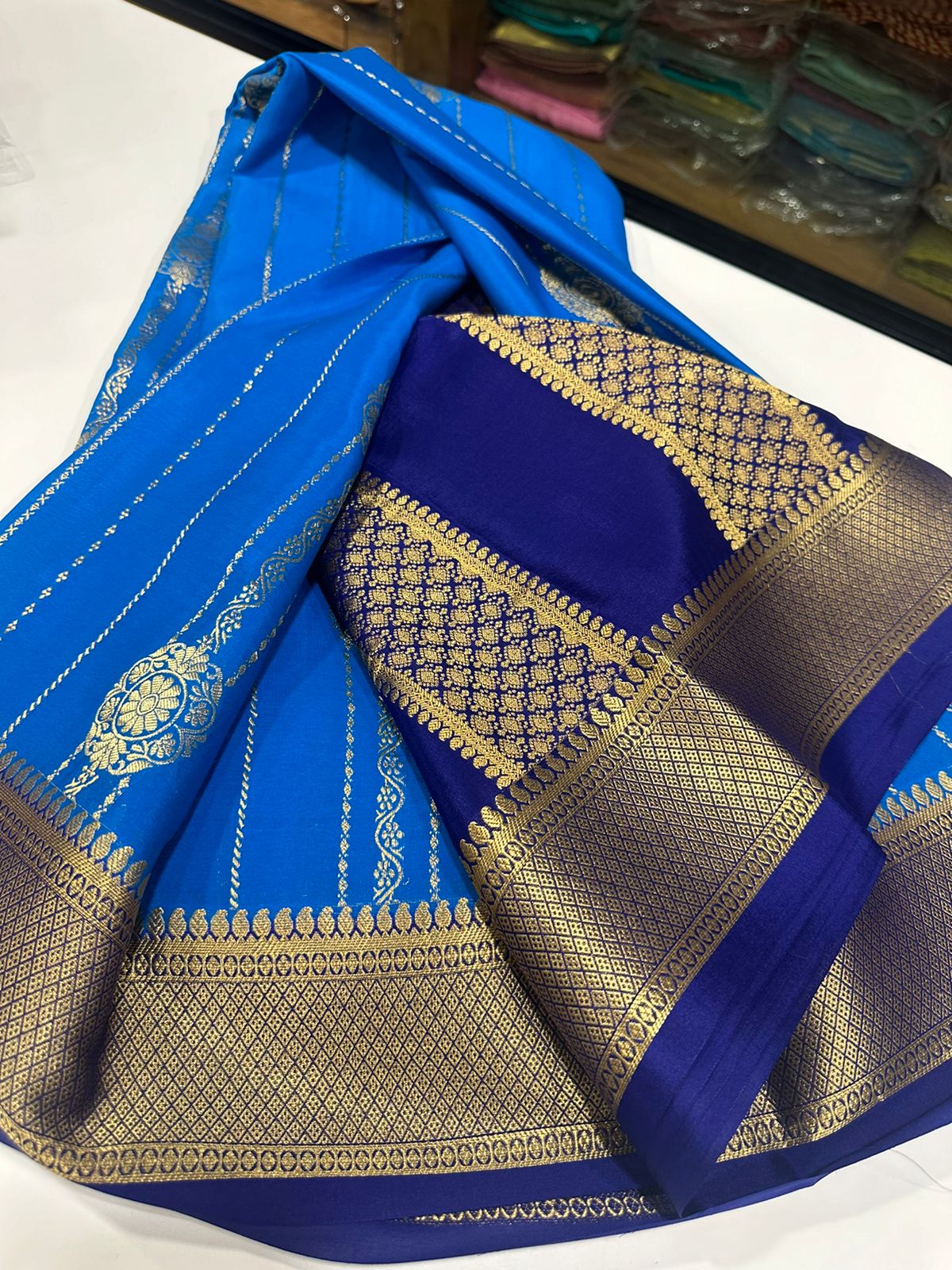 Pure Mysore silk sarees
120 grm thickness  with rich pallu 
Silk mark certified
Big Bentex border with motifs on the body n vertical lines   .....small motifs all over body with rich pallu