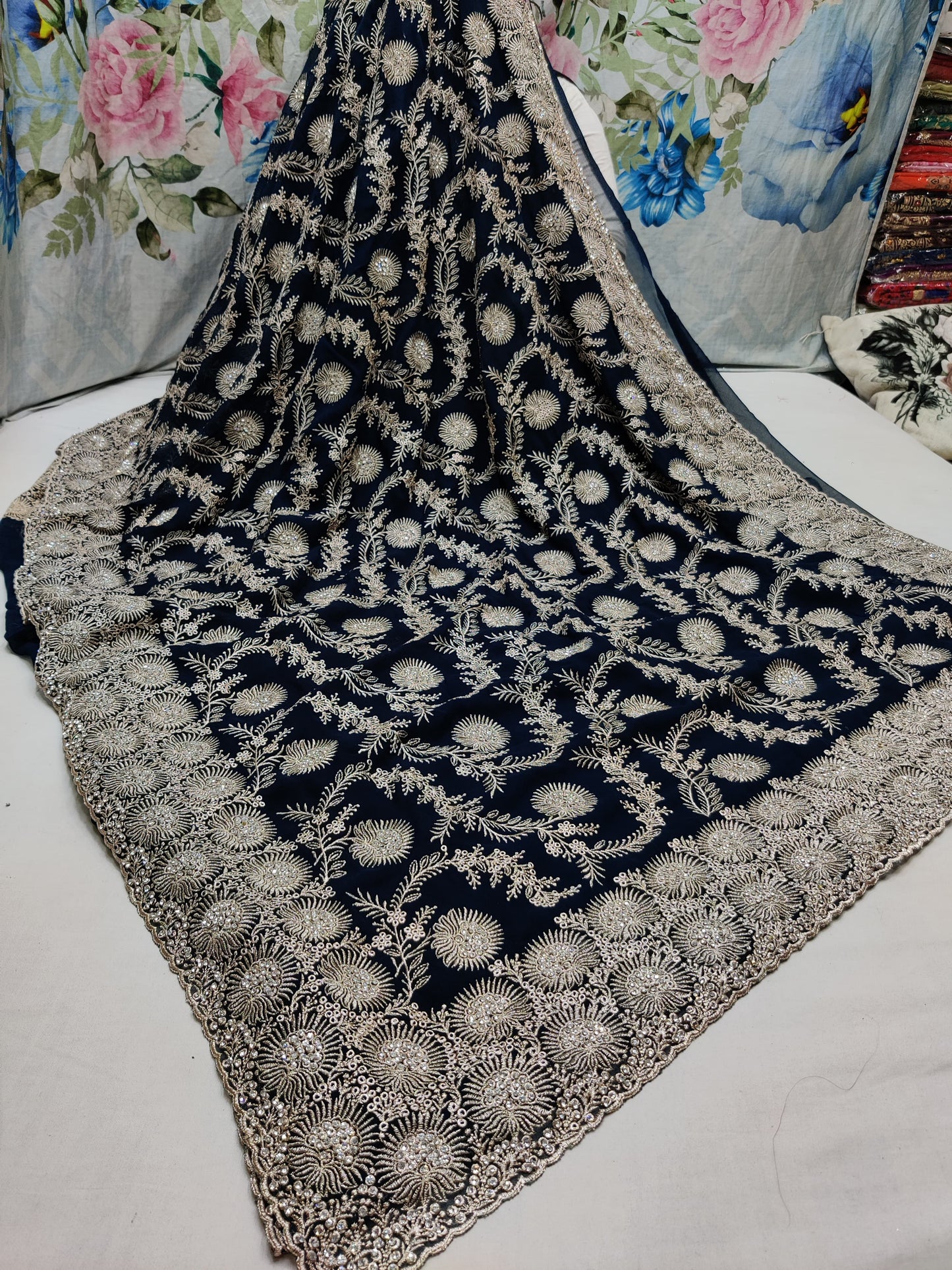 Allover silver jari jall with jarkan stone border on Georgtee 
Saree