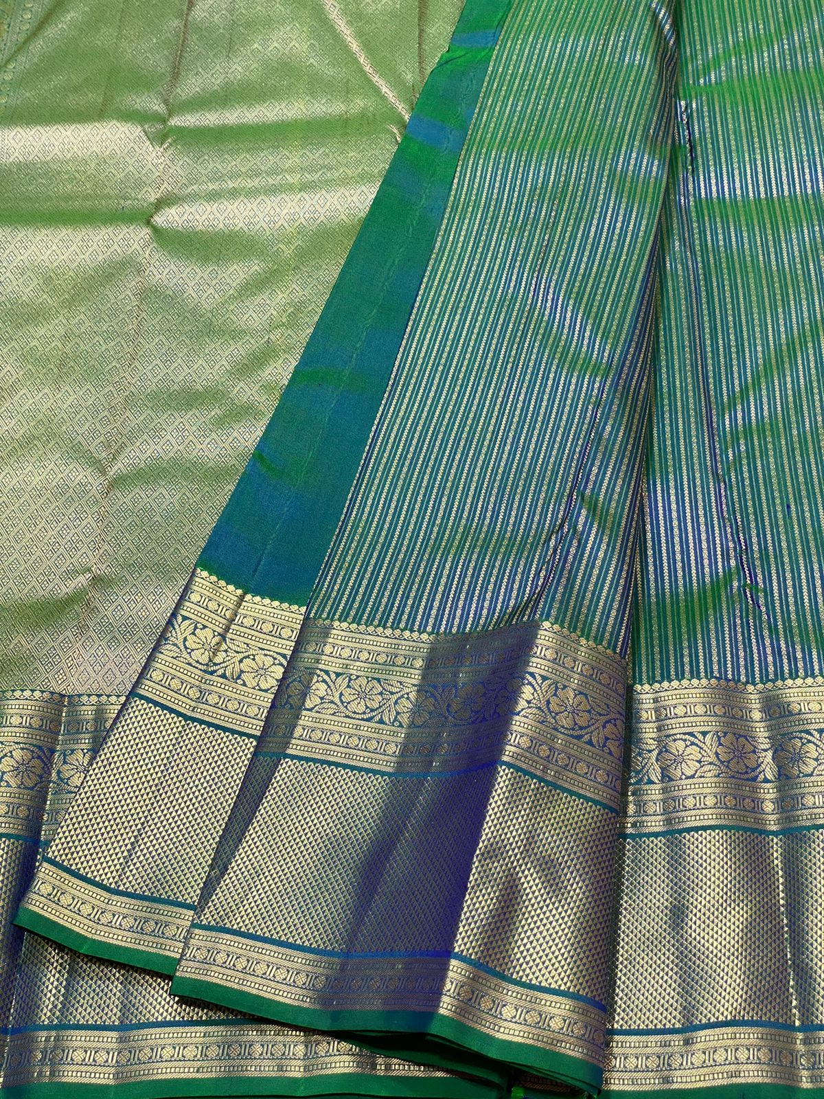 Pure Kanchivaram handloom silk saree with pure 2g zari traditional long border strip butta all over saree 
Silkmark certified