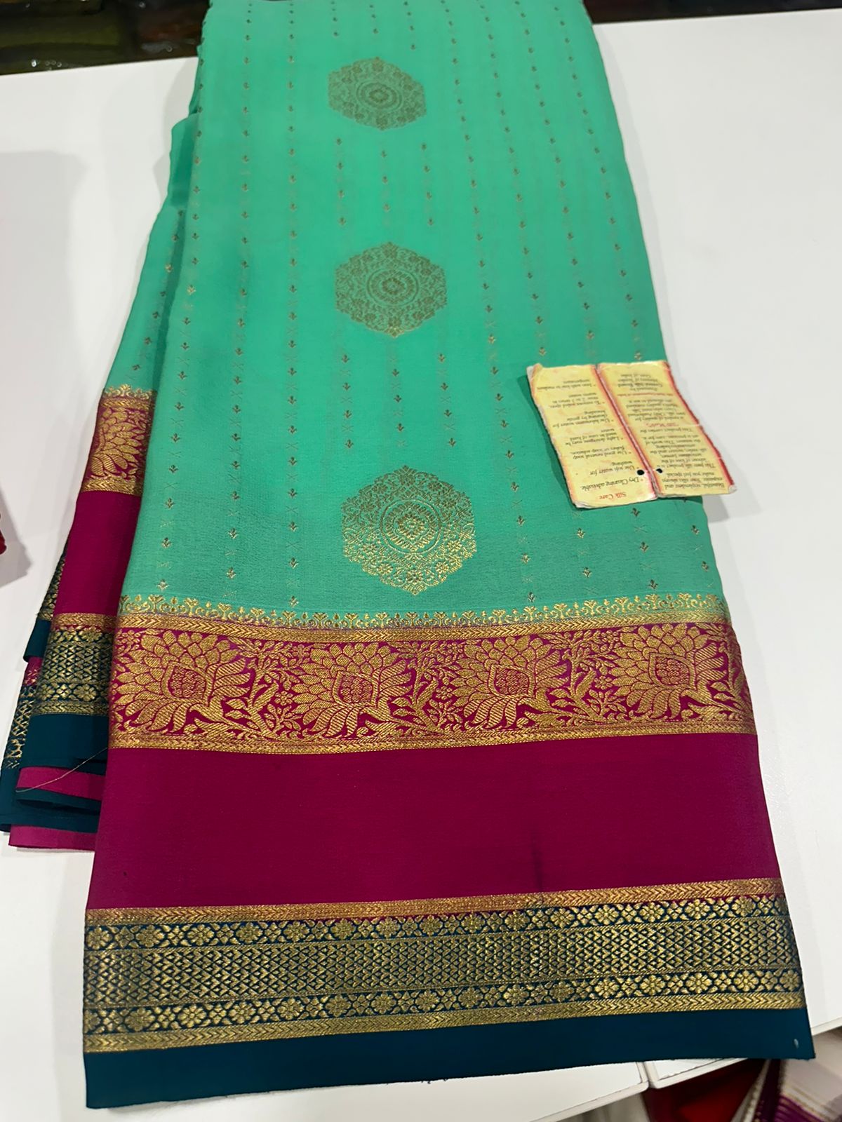 Pure Mysore silk sarees
120 grm thickness  with rich pallu 
Silk mark certified
Big Bentex border with motifs on the body n vertical lines   .....small motifs all over body with rich pallu