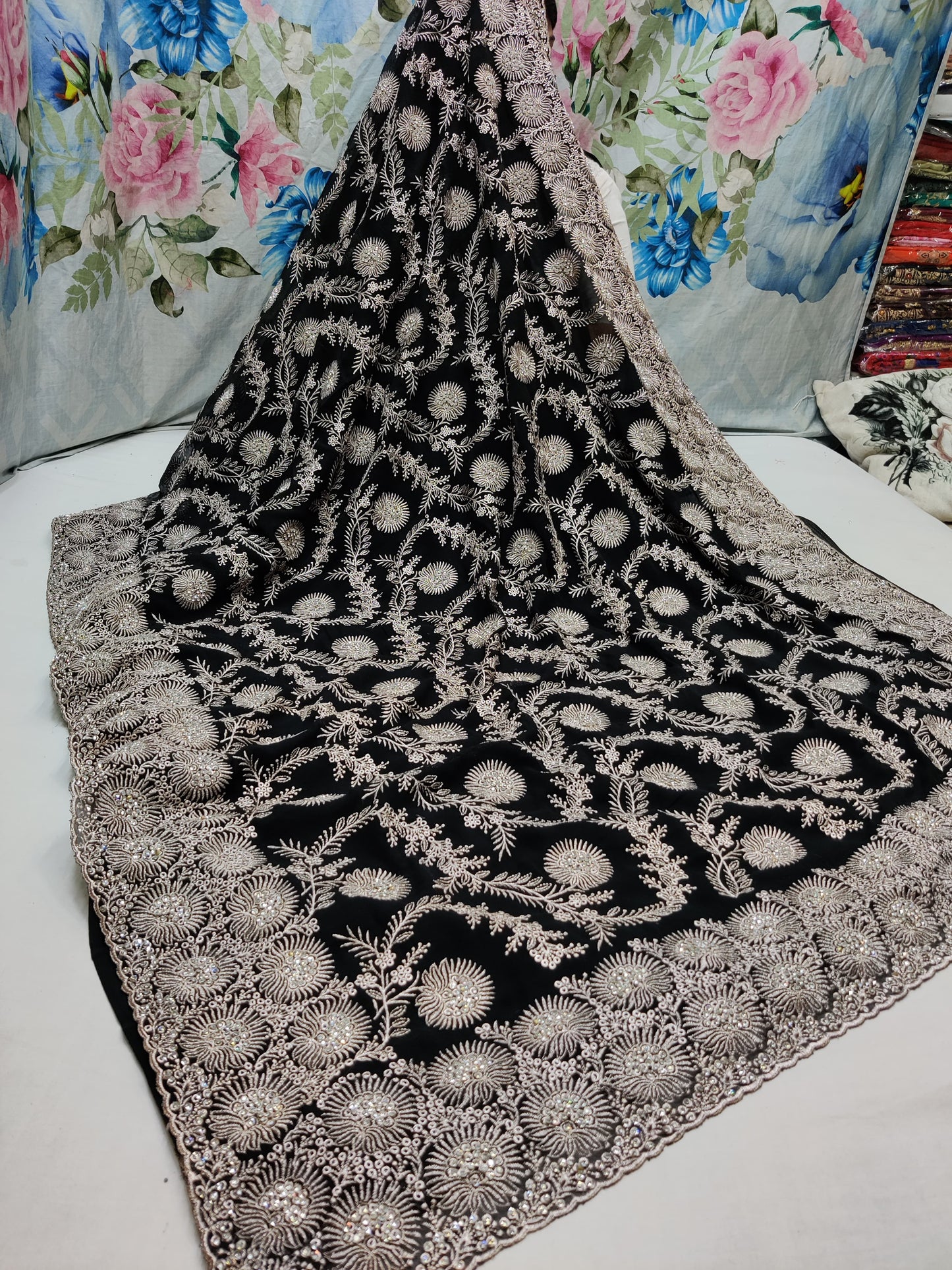 Allover silver jari jall with jarkan stone border on Georgtee 
Saree