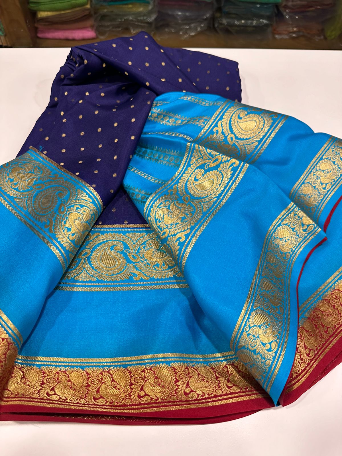 Pure Mysore silk sarees
120 grm thickness  with rich pallu 
Silk mark certified
Big mango n peacock design on border