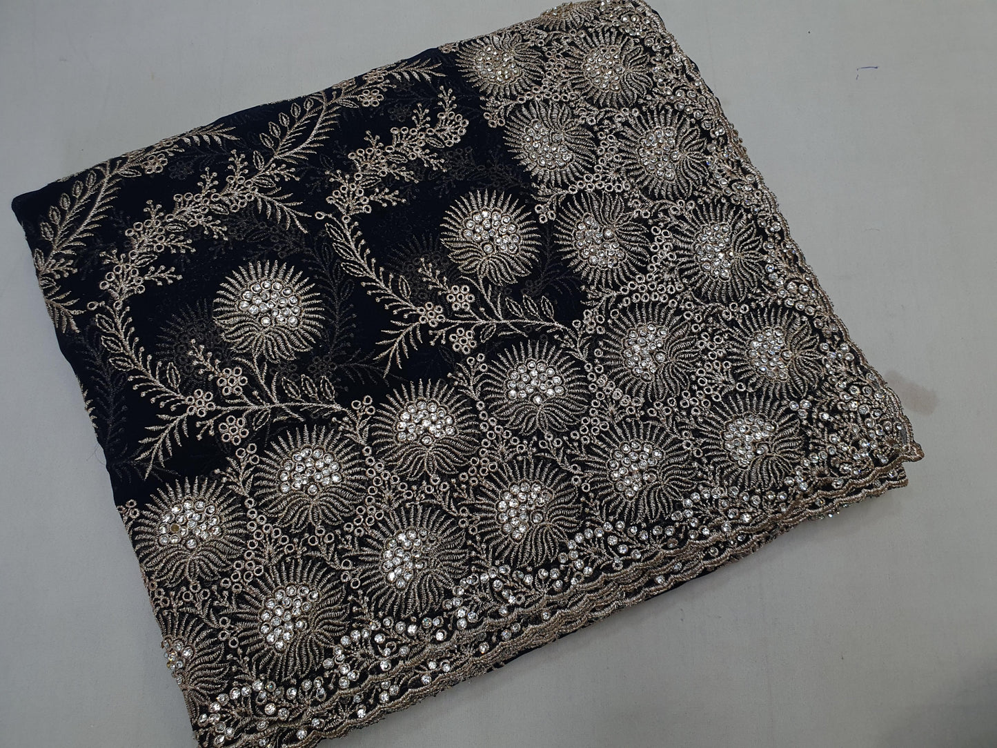 Allover silver jari jall with jarkan stone border on Georgtee 
Saree