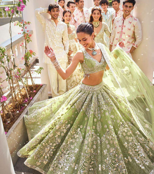 LEHENGA CHOLI 
Lehenga  Fabric-Butterfly Net
Lehenga work-Foil Mirror Sequins Work With Cancan & Canvas Patta
Lehanga Flare-4 Meter Flared
Lehenga Type- Semi stitched
Lehenga Length- 42
Lehenga Size - Upto 44