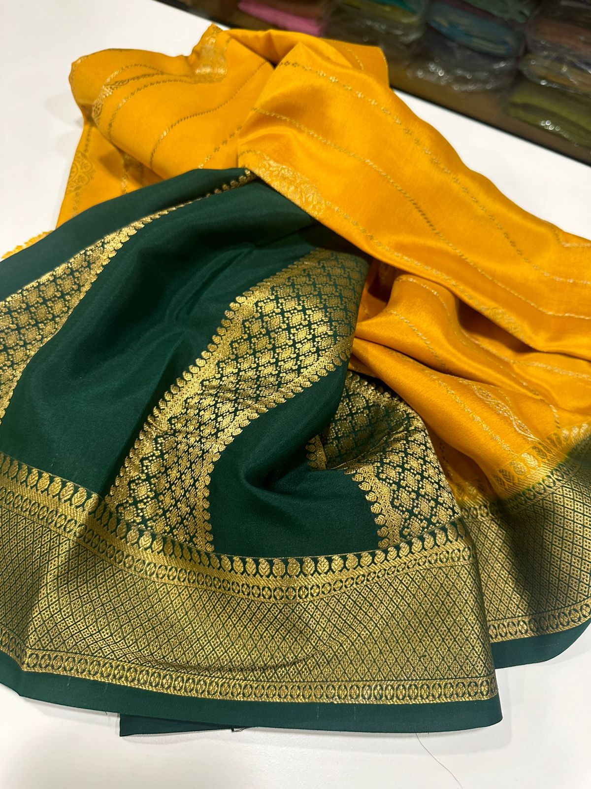 Pure Mysore silk sarees
120 grm thickness  with rich pallu 
Silk mark certified
Big Bentex border with motifs on the body n vertical lines   .....small motifs all over body with rich pallu