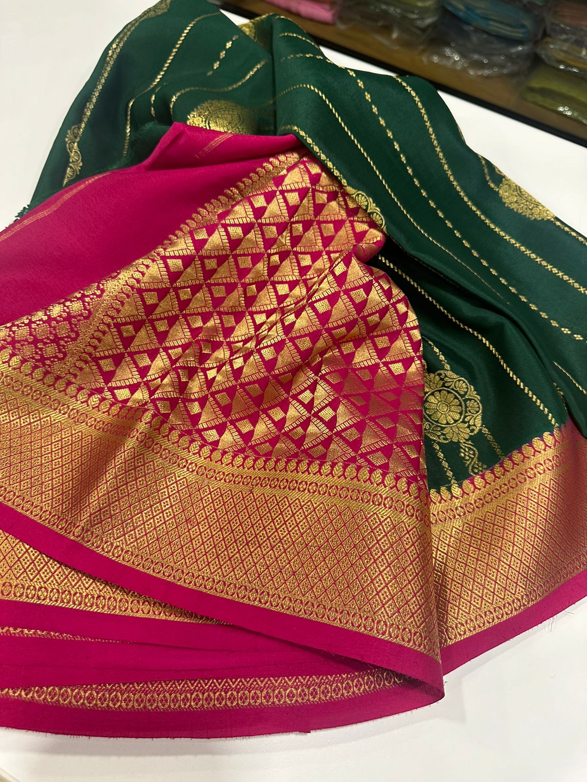 Pure Mysore silk sarees
120 grm thickness  with rich pallu 
Silk mark certified
Big Bentex border with motifs on the body n vertical lines   .....small motifs all over body with rich pallu