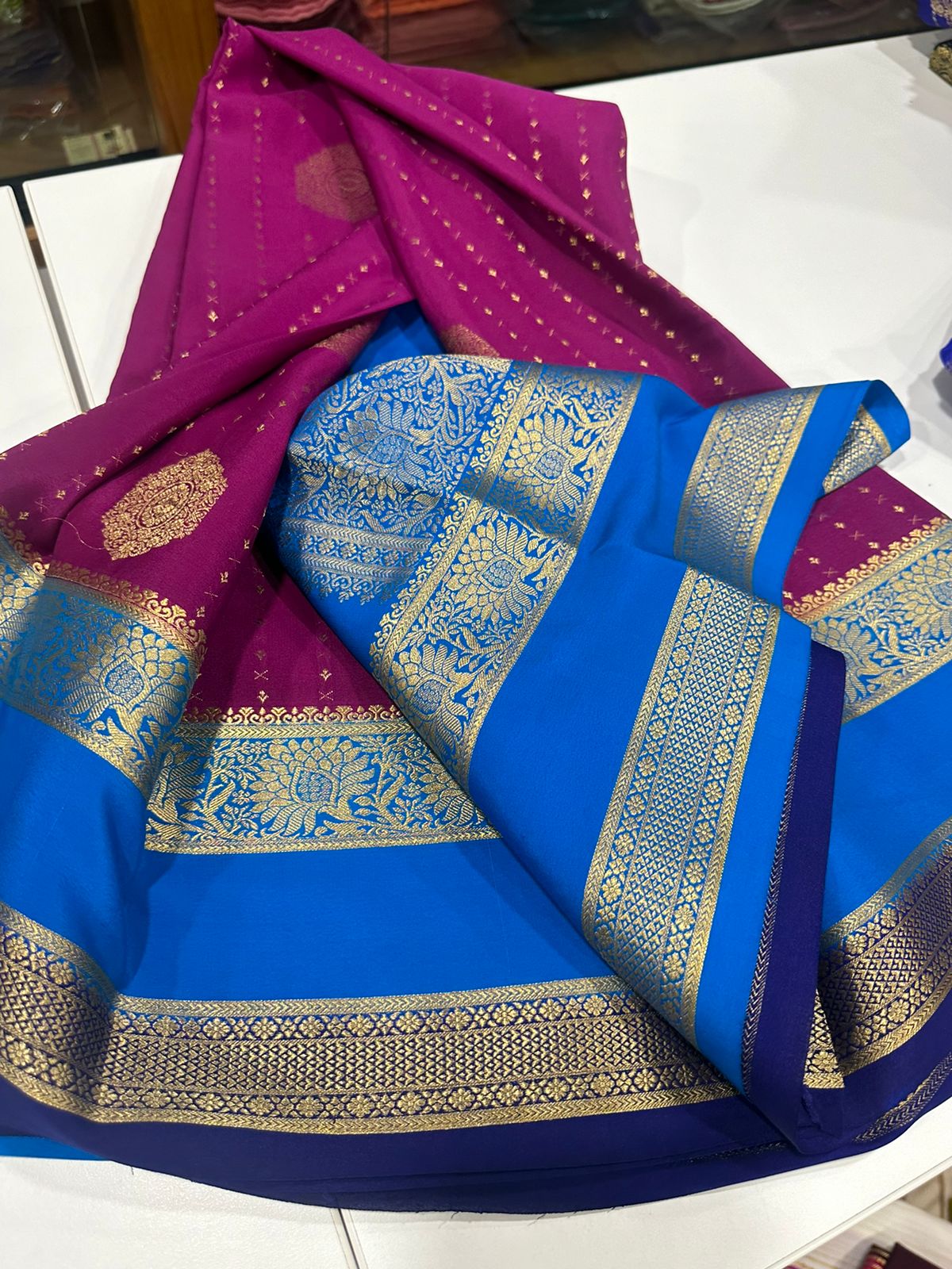 Pure Mysore silk sarees
120 grm thickness  with rich pallu 
Silk mark certified
Big Bentex border with motifs on the body n vertical lines   .....small motifs all over body with rich pallu