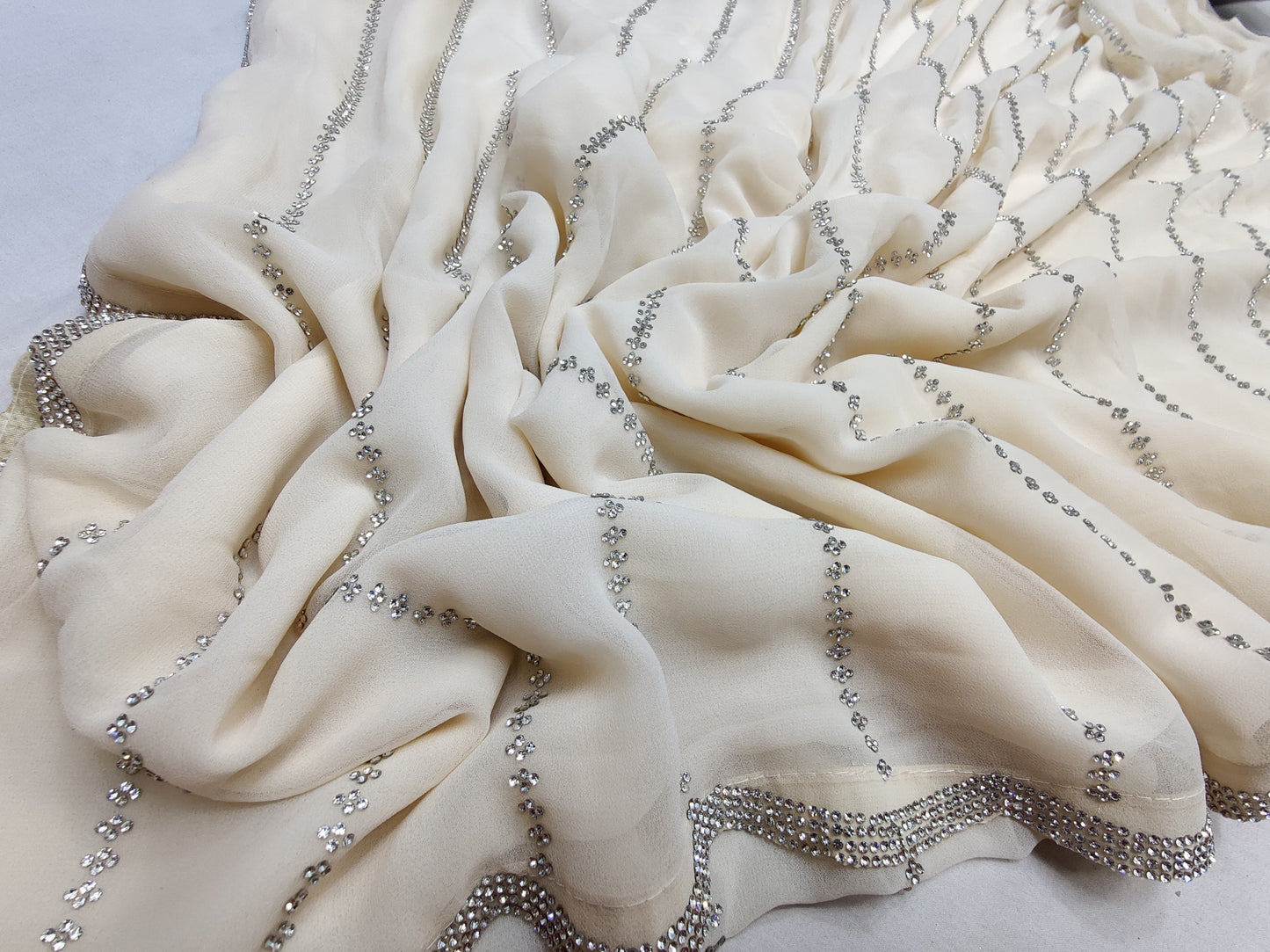 ALLOVER JARKAN STONE WORK AND BORDER ON PURE GEORGETTE*saree