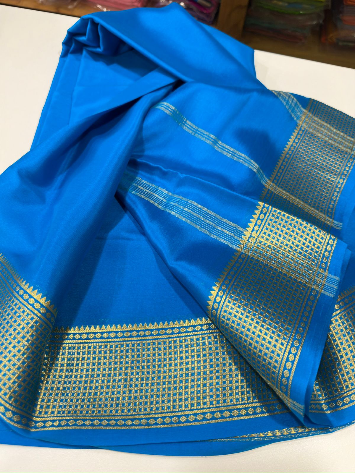 Pure Mysore silk sarees
110 grm thickness 
Silk mark certified.           Traditional border with beautiful Colors💙